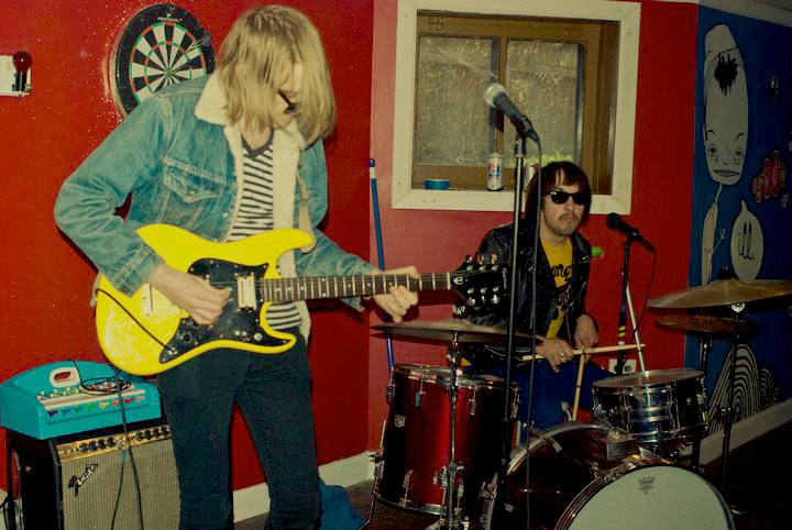 the handsome Slushy Slushy is a cool band from Chicago. In this picture they're playing at Ian's birthday party.